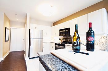 Kitchen with white cabinets and stainless steel appliances